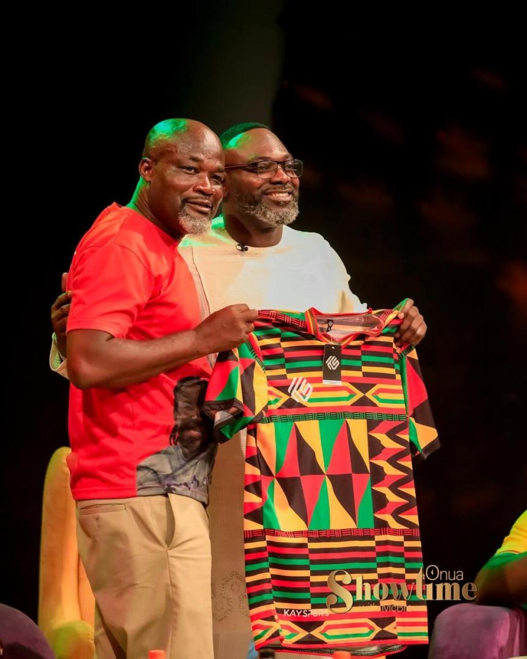 Former Black Stars captain John Mensah proudly displays Kaysports branded Ghana jersey presented to him by CEO Kwame Owusu-Ameyaw