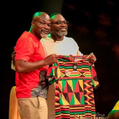 Former Black Stars captain John Mensah proudly displays Kaysports branded Ghana jersey presented to him by CEO Kwame Owusu-Ameyaw